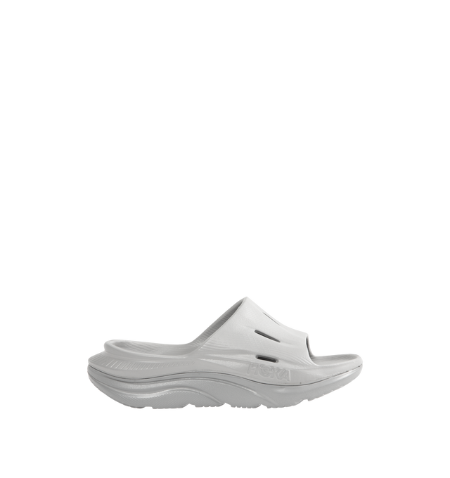 Image 1 of 4 - GREY - HOKA Ora Recovery Slide 3 featuring perforated rubber upper with EVA sole, slip-on styling and molded footbed.