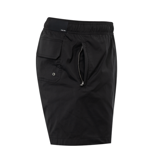 Image 3 of 3 - BLACK - AMIRI Staggered Chrome Swim Trunk featuring elastic waistband with drawstring tie closure, 3-pocket styling, side Amiri logo detail and mesh lining. 100% polyester. 