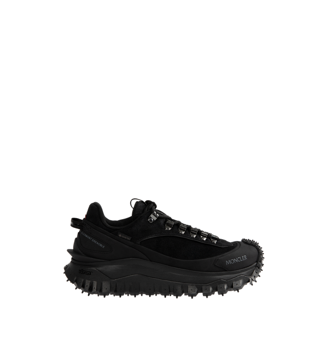 Image 1 of 5 - BLACK - Moncler Trailgrip Apex Low Top Sneakers are a lace-up style with GORE-TEX waterproof membranes, EVA midsoles, Vibram treads, OrthoLite insoles, and TPU spoiler soles. Made in Vietnam.
