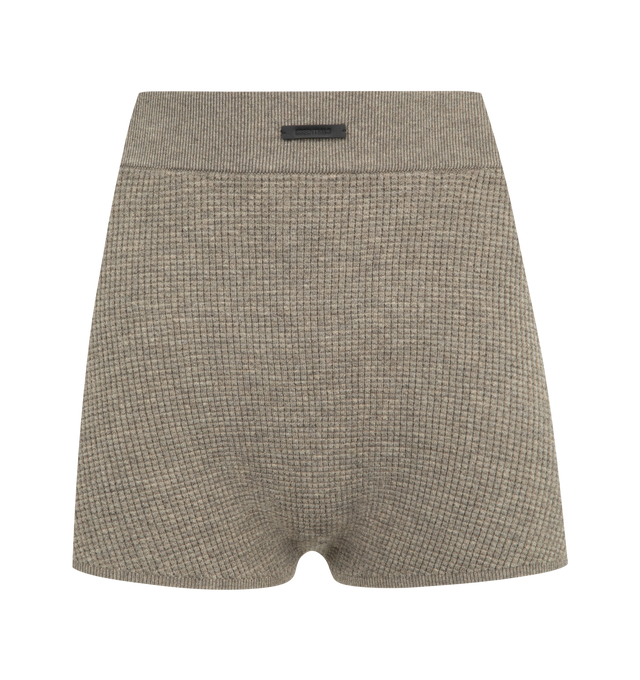 Image 1 of 3 - BROWN - FEAR OF GOD ESSENTIALS Waffle Short featuring a poly-nylon waffle knit, cropped silhouette, rib-knit elastic waistband and new Fear of God rubberized label. 88% polyester, 12% nylon waffle knit.