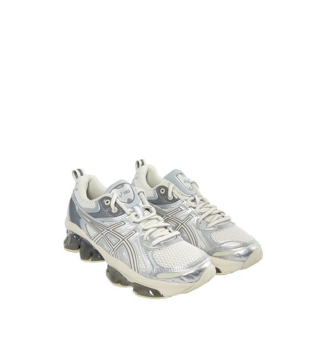 Image 2 of 5 - WHITE - ASICS GEL-QUANTUM KINETIC sneaker combines experimental engineering with functional details for everyday scenarios. Its performance capability is met with technical components to create a modern design thats built for urban exploration. ? Synthetic leathers and various mesh panels are layered throughout the upper to improve comfort. Midsole features Scutoid GEL technology that has a closely packed 3D geometry and an off-axis structure to improve shock absorption in daily scenarios, li