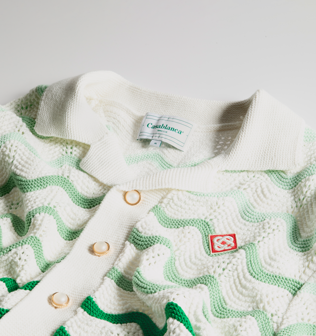 Image 3 of 3 - GREEN - CASABLANCA Gradient Wave Texture Shirt featuring front button closure with pearlescent buttons, wavy stripe pattern, midweight crochet knit fabric with Casablanca logo patch at chest. 100% cotton. Made in China. 