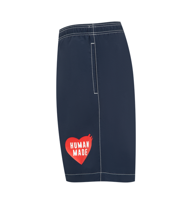 Image 3 of 3 - NAVY - HUMAN MADE Swim Shorts featuring elasticated waistband, 2 side pockets, contrast stitching and embroidered branding. 100% nylon.
