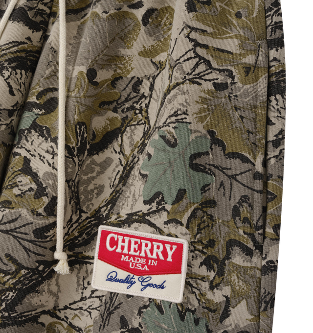 Image 3 of 6 - GREEN - Cherry LA Chevron Parachute Sweatpants are crafted from custom cotton fleece and feature a wide-leg silhouette with a relaxed, laid-back fit. Designed with a patch detail at the leg, an adjustable drawcord waistband, and a branded label at the back pocket, these everyday sweatpants blend comfort-focused construction with Cherry LA's signature contemporary aesthetic. Main Material: Custom Cotton Fleece. Made in Los Angeles, USA.