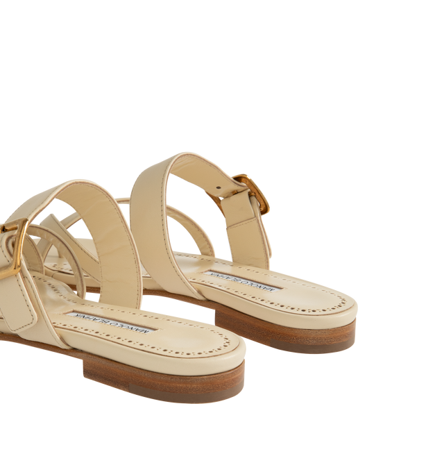 Image 3 of 4 - NEUTRAL - Manolo Blahnik Thalusa nappa leather flat sandals featuring an open toe, crossover front straps with toe stem, instep strap with gold buckle design detail and flat stacked 10mm heel. Upper: 100% lamb nappa. Sole: 100% calf leather. Lining: 100% kid leather. Made in Italy.