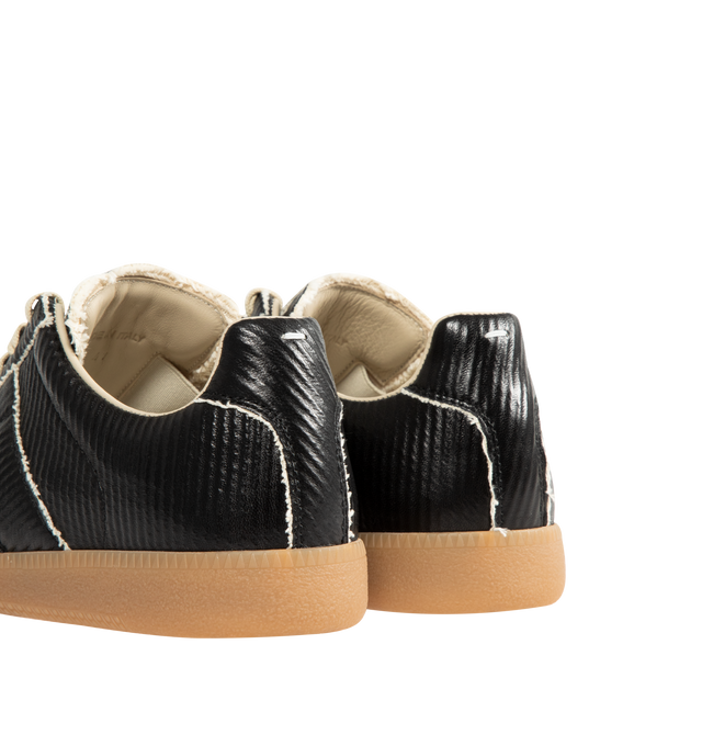 Image 3 of 5 - BLACK - MAISON MARGIELA Replica Sneakers featuring low-top sneakers in cracked leather, panel detailing, lace-up front, textured gum sole and white stitching at the back. Upper: 100% Ovine Leather. Lining: 100% Cotton. Sole: 100% Rubber. Made in Italy.