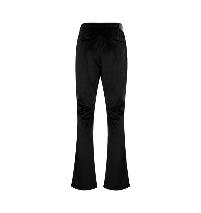Image 2 of 3 - BLACK - AMIRI Velvet Flare Track Pant featuring back welt pockets, side slit pockets, elastic waist with drawstring, logo patch on back and flared leg. Made in Italy.
