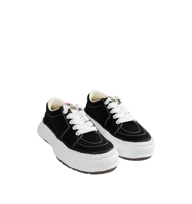 Image 2 of 5 - BLACK - Maison Mihara Yasuhiro Men's Eric Sneakers feature the brand's signature hand-sculpted OG sole, a mixed-material suede and canvas upper, and distinctive toe stitching for a bold contemporary look. Designed for the Spring/Summer 2026 collection, these designer low-top sneakers combine Maison Mihara Yasuhiro's experimental aesthetic with everyday comfort, while the handcrafted-inspired sole and intentional vintage detailing create a truly distinctive silhouette. Main Material: Cow Leath