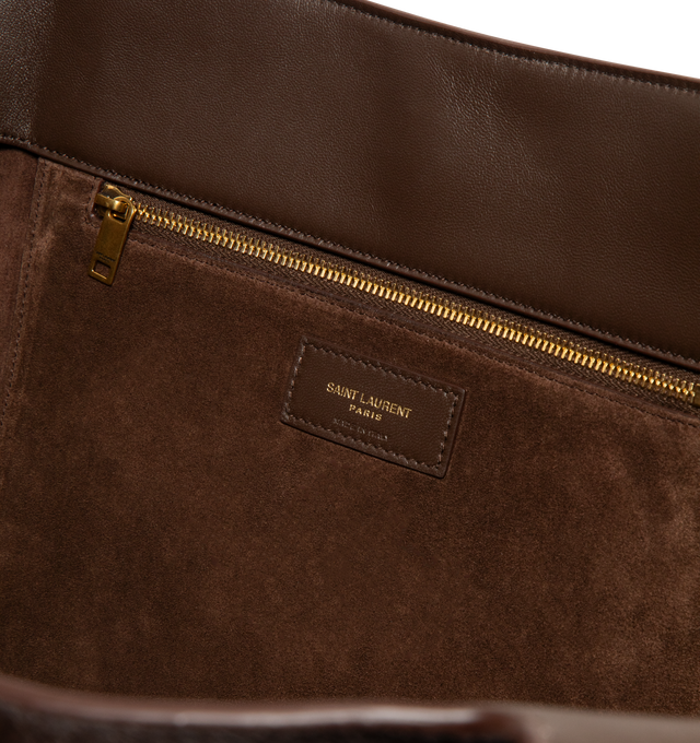 Image 3 of 3 - BROWN - SAINT LAURENT Le 5 7 Bea in pony hair leather featuring lightweight and fully lined in tonal suede, inner zip pocket, leather tab closure, an east/west format, inner ties that allow the sides to be collapsed or expanded and bronze-tone hardware. 19.7" x 11" x 7.1". Calfskin leather. Made in Italy.