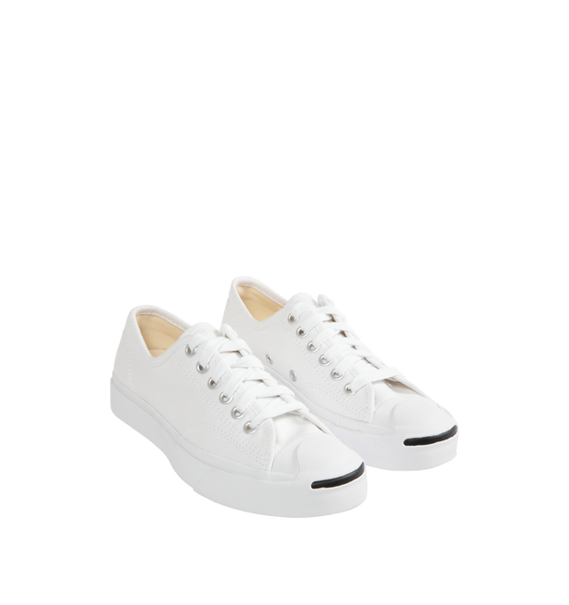 Image 2 of 5 - WHITE - Converse Jack Purcell Sneakers in a refined, sporty low top style. Featuring durable canvas upper, layers of comfort cushioning with a wedge helps provide optimal support, signature smile branding on the toe cap, and rubber sole with herringbone details helps provide traction. Unisex style in men's sizes.