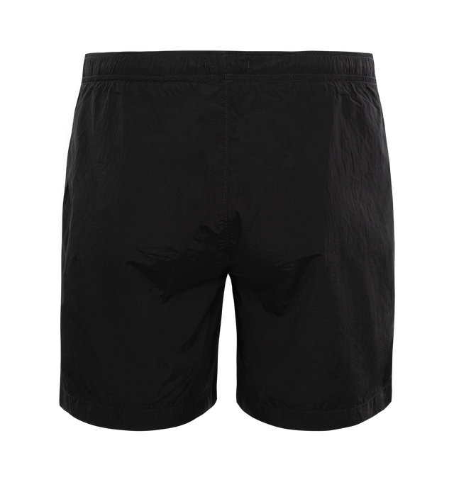 Image 2 of 3 - BLACK - C.P. COMPANY Eco-Chrome R Swim Shorts featuring tonal stitching, two side slash pockets, logo patch to the leg, short side slits, thigh-length, mesh lining and elasticated waistband with internal drawstring. 100% polyamide. 