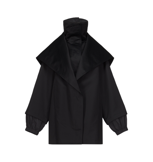 Image 1 of 3 - BLACK - Azzedine Alaa Womens Layered Parka is crafted from structured cotton canvas. Features a high neck, raglan sleeves, concealed placket, side seam pockets, back yoke, zipped hood, and back zipper that reveals a second layer underneath. Designed with a rounded shape and layered construction that can be worn as a traditional hooded jacket or fully opened and draped as a cape. Main Material: 88% Cotton; 32% Viscose, Secondary Material: 74% Polyamide, 26% Silk; Padding: 100% Polyester; Pocke