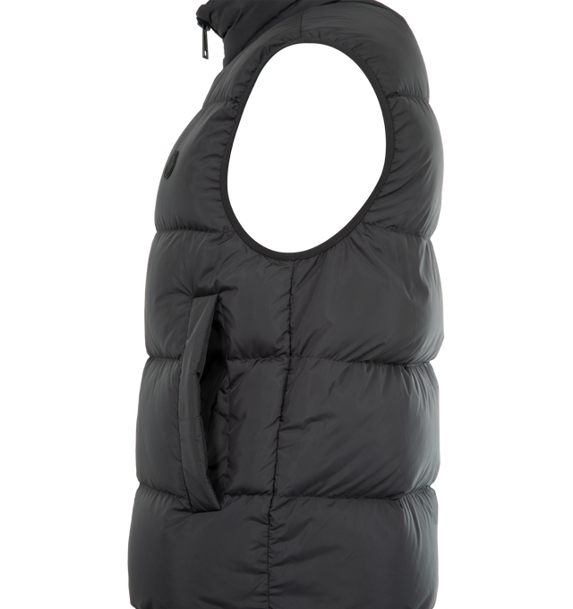 Image 3 of 3 - BLACK - MONCLER Gabas Down Vest featuring micro soft lining, down-filled, stand collar, zipper closure, side pockets with snap button closure, zipped inner pockets, elastic cuffs and hem and silicone logo patch. 100% polyester. Padding: 90% down, 10% feather. Made in Romania.
