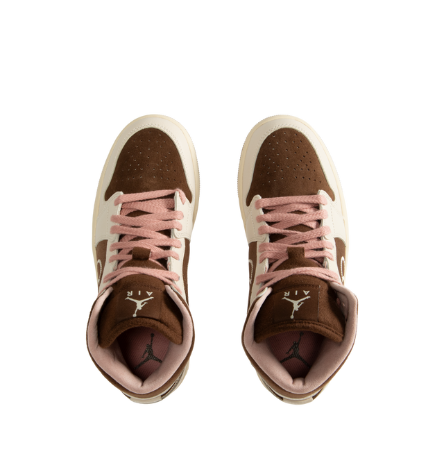 Image 5 of 5 - BROWN - Air Jordan 1 Mid Women's Shoes feature the iconic basketball-inspired silhouette and combine premium comfort with everyday wearability. Crafted with a durable leather upper, this classic style is equipped with an encapsulated Nike Air-Sole unit and a foam midsole for lightweight cushioning, while a rubber outsole provides reliable traction. Finished with a padded collar and traditional lace-up closure, the AJ1 Mid delivers timeless Jordan heritage with lasting support. Main Material: