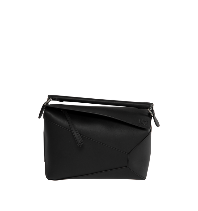 Image 1 of 3 - BLACK - Loewe Medium Puzzle Edge bag in soft grained calfskin featuring a cuboid shape and precise cutting technique to create Puzzles distinctive geometric lines. Shoulder, crossbody or hand carry with a detachable and adjustable strap, top handle. Featuring zip closure with calfskin pull, herringbone cotton canvas lining, embossed Anagram.  Height 7.7" X Width 11.4" X Depth 5.5". Made in Spain.
