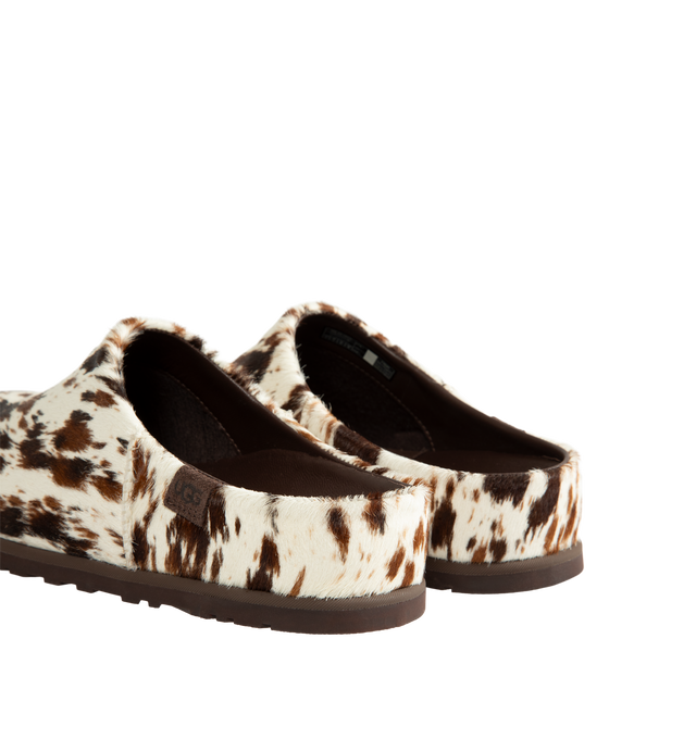 Image 3 of 4 - BROWN - Ugg Men's Otzo Western Clog is crafted with a hand-painted cow hair upper and reimagines the brands signature clog silhouette through a Western-inspired lens. Designed for all-day comfort, this distinctive style features a leather and RWS wool jersey lining enhanced with a peppermint-based anti-odor treatment, along with a contoured EVA footbed for cushioning and support. A leather and microfiber sockliner provides additional comfort, while the lightweight rubber outsole with 30% FCS-