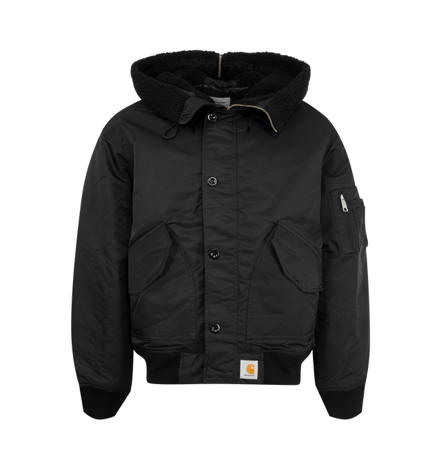 Image 1 of 2 - BLACK - CARHARTT WIP Hooded Oltera Bomber Jacket featuring water-repellent material, triple-stitched, adjustable, pile lined hood with detachable pile brim and back zip, zip and button closure, rib-knit cuffs and bottom band, two pockets with hidden snap buttons, sleeve pocket with zip closure, inside pocket and square label. 100% nylon, 5.2 oz.