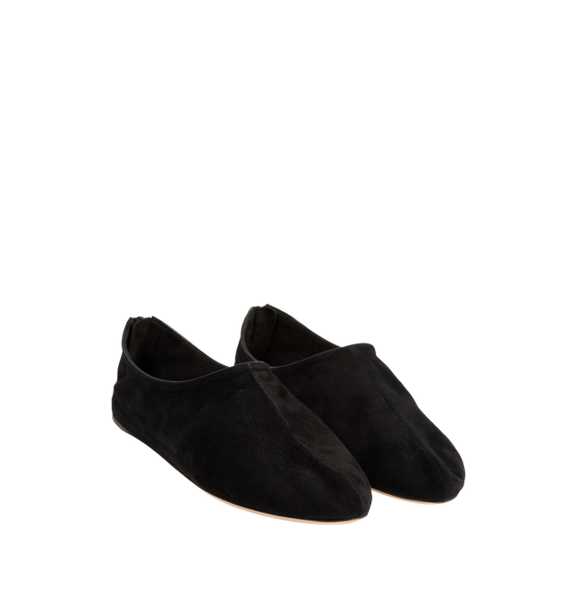 Image 2 of 4 - BLACK - The Row Women's Stellene Slipper is crafted from ultrasoft goatskin suede and features a minimal silhouette with a round toe, back zip closure, and a thin leather sole. Designed for everyday elegance, this streamlined style is lined in goatskin leather and finished with a supple suede upper for exceptional comfort and flexibility. Main Material: 100% Goatskin Suede. Lining: 100% Goatskin Leather.
