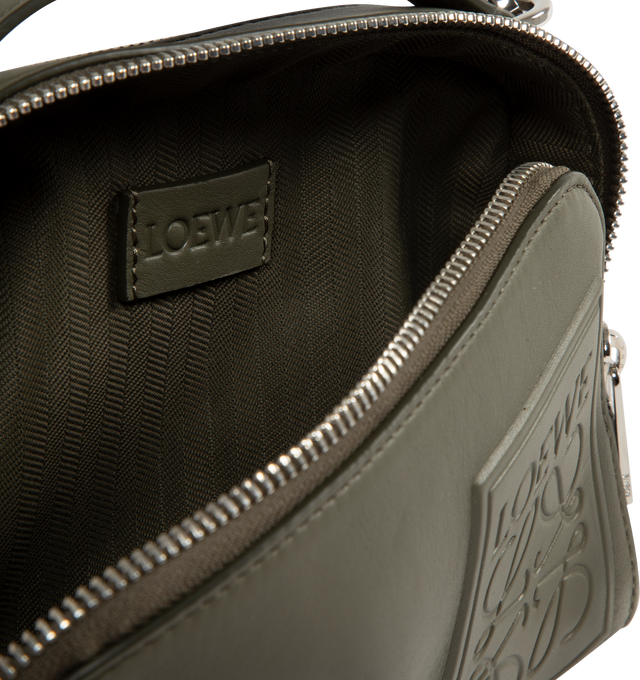 Image 3 of 3 - GREEN - LOEWE Mini Crossbody Camera Bag in satin calfskin featuring two zipped compartments, crossbody or hand carry, adjustable and detachable LOEWE webbing strap, herringbone cotton canvas lining and debossed LOEWE Anagram patch. Satin calf. 13 cm x 18 cm x 8.5 cm. Made in Portugal.