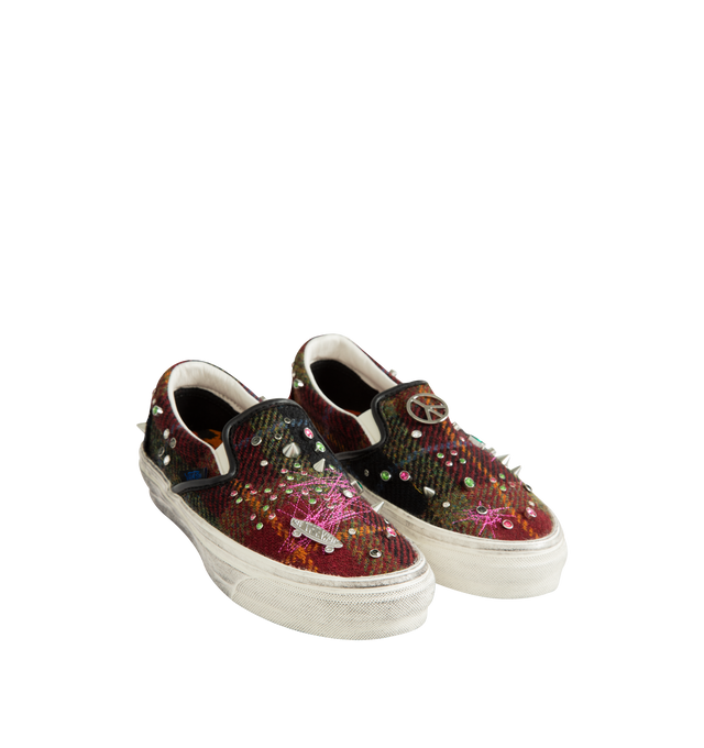 Image 2 of 5 - MULTI - Vans Unisex Premium Classic Harris Tweed Slip-On Sneakers are crafted from Harris Tweed woven from 100% virgin wool and feature the brand's iconic laceless slip-on silhouette, elastic side panels, and a padded collar for enhanced comfort. Designed with jewel, pin, and stud embellishments, contrast stitching, and a subtly distressed finish. Main Material: Harris Tweed 100% Virgin Wool. Outsole: Rubber. Details: Jewel, Pin, and Stud Embellishments. *Unisex style in men's sizing.