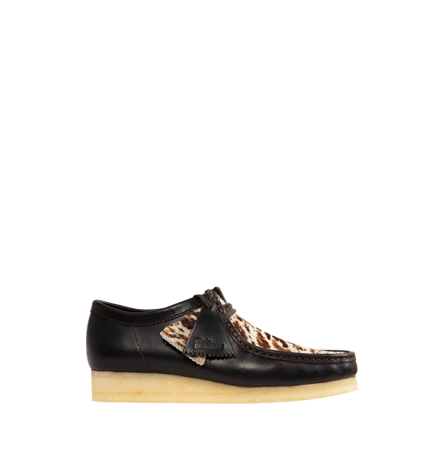 Image 1 of 4 - BROWN - CLARKS Wallabee Shoe featuring moccasin construction, hand stitched apron seam, leather side quarters with hair on speckled vamp, flat tonal lace, wo FOBS Clarks Originals and Wallabee and natural pebble crepe sole.