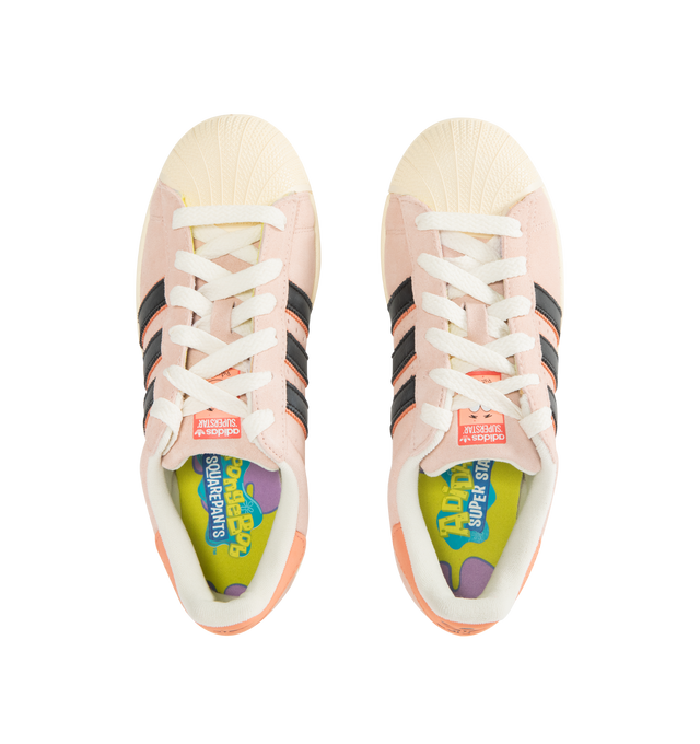 Image 5 of 5 - PINK - ADIDAS SpongeBob's Patrick Superstar Sneaker featuring 3-stripes, custom Patrick graphic on the tongue, translucent outsole reveals underwater scenes from under the sea, suede upper, lace up closure, branded details, rubber shell toe and rubber sole.