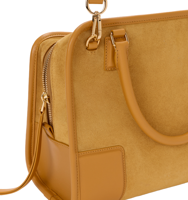 Image 16 of 16 - YELLOW - Loewe Women's Amazona 180 Medium Bag is crafted from suede and calf leather and features a relaxed silhouette with a single toron top handle, a concealed magnetic closure, and removable shoulder and crossbody straps. Designed with two compartments, an internal flat pocket, and a side D-ring for personalization, this versatile style can be carried by hand, over the shoulder, or crossbody. Suede lining and embossed LOEWE branding complete the design. Main Material: Suede/Calf Leather