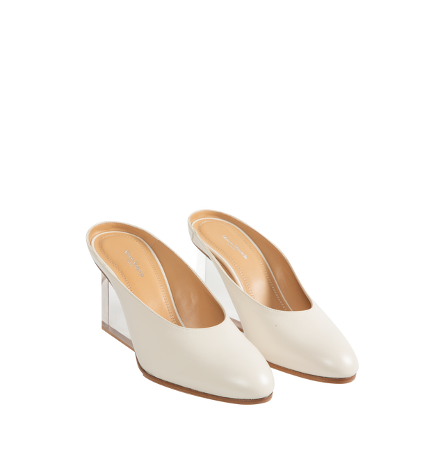 Image 2 of 4 - WHITE - Maison Margiela Women's Plexi Pump Mules are crafted from white calf leather with a soft, polished finish. The slip-on silhouette features a rounded toe, open back, sculpted transparent wedge heel, and the Maison's signature single white stitch at the back. Upper: 100% Calf Leather. Lining: 100% Ovine Leather. Contrast: 100% Calf Leather. Sole: 100% Calf Leather. Made in Italy.