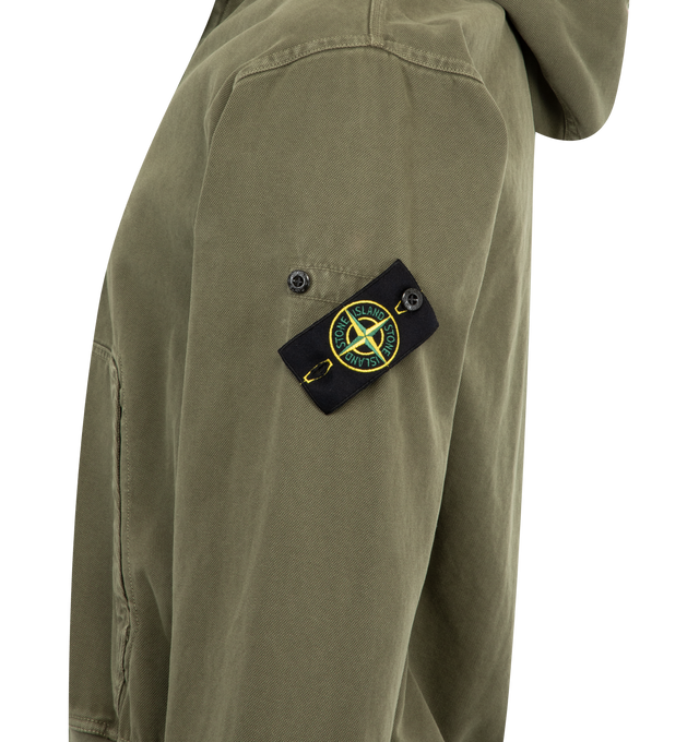 Image 3 of 3 - GREEN - STONE ISLAND Hoodie Sweater featuring hood with ribbed cotton lining around contour, fixed drawstring, ribbed cotton inserts at shoulders, under armholes, and on sides, hand patch pockets with slanted entrance, Stone Island badge on left sleeve, ribbed cotton cuffs and bottom band and oversized fit. 100% cotton.