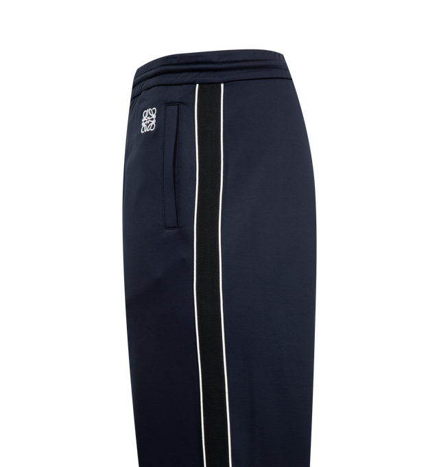Image 3 of 3 - NAVY - Loewe Men's Tracksuit Trousers in lightweight technical jersey. Relaxed fit, regular length featuring mid waist, straight leg, elasticated waist with drawstring, zipped pockets, zipped rear pocket, herringbone side tape and Anagram embroidery placed at the front. Polyamide/Cotton. Made in Portugal.