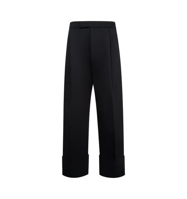 Image 1 of 3 - NAVY - THOM BROWNE Backstrap Double Pleat Trouser featuring high rise, tab front closure, slip side pockets, back welt pockets, front pleats, wide cuffs and adjustable buttoned backstrap. Made in Italy.