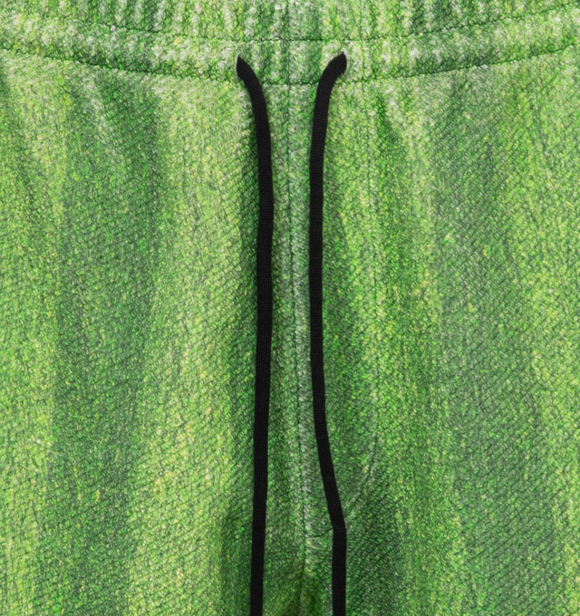Image 4 of 4 - GREEN - Le Pere Astro sweatshorts recreate the quintessential turf from grass football pitches printed on the inside of an Italian sweatshirt cotton fabric. Features an embroidered patch on the bottom left leg as well as a pocket in the back. 100% Cotton. Made in Portugal.  