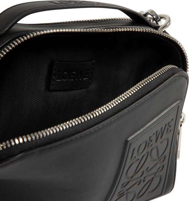 Image 3 of 3 - BLACK - LOEWE Mini Crossbody Camera Bag in satin calfskin featuring two zipped compartments, crossbody or hand carry, adjustable and detachable LOEWE webbing strap, herringbone cotton canvas lining and debossed LOEWE Anagram patch. Satin calf. 13 cm x 18 cm x 8.5 cm. Made in Portugal.