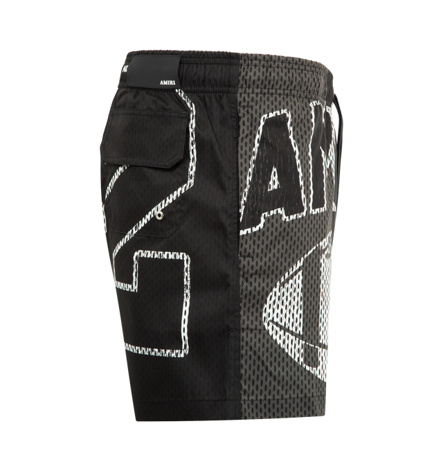 Image 3 of 3 - BLACK - AMIRI Spliced Swim Trunk featuring spliced treatment, side seam pockets, elastic waistband with drawcord and back flap pocket. 100% polyester.