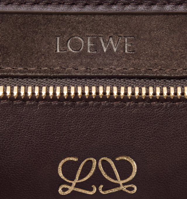 Image 12 of 13 - BROWN - LOEWE Mini Amazona 180 Bag in suede featuring a relaxed silhouette anchored by a single toron top handle, designed to be carried open, while a concealed closure secures the main compartment, removable shoulder and crossbody straps, two carry options: short handle, removable and adjustable crossbody strap, zip closure with two leather zip pullers, two compartments, main compartment closed with magnetic closure, left side d-ring for customization, suede and nappa lambskin lining, embo