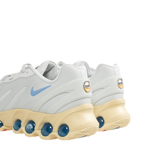 Image 3 of 5 - WHITE - NIKE Air Max Dn8 Sneaker featuring Dynamic Air system with dual-chambered tubes with tuned pressure levels, sculpted upper made from lightweight mesh, plastic heel clip, foam midsole and rubber outsole.