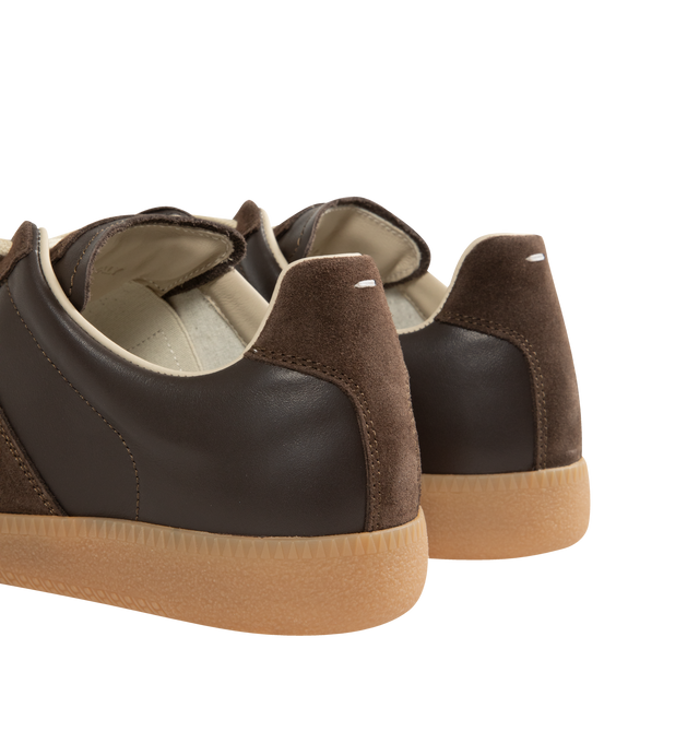Image 3 of 5 - BROWN - Maison Margiela Replica Sneakers featuring lace-up sneakers in buffed nappa calfskin and calfskin suede, contrasting sole, Maison Margiela logo label on the tab, internal Replica label, internal elastic and all-over Maison Margiela logo insole. 100% calf leather. Sole: 100% rubber. Made in Italy.