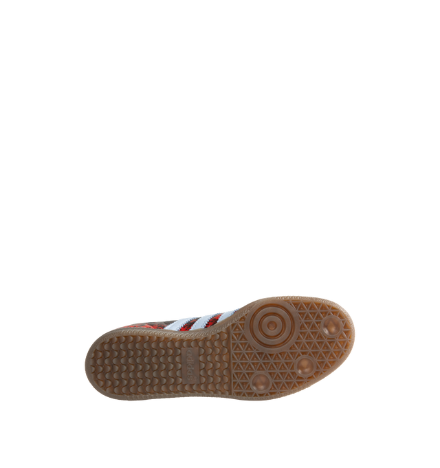 Image 4 of 5 - RED - Adidas Women's Samba OG Shoes reinterpret the brands iconic soccer-inspired silhouette with premium leather construction and heritage detailing. Designed with a lace-up closure and the signature elongated tongue, this updated version pairs classic Samba styling with modern versatility. Metallic Samba branding and Trefoil detailing celebrate the legacy of adidas Originals, while the durable rubber outsole provides reliable traction for everyday wear. Main Material: Leather. Closure: Lace