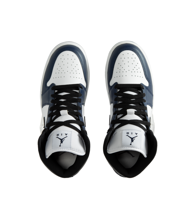 Image 5 of 5 - NAVY - Air Jordan 1 Mid Men's Shoes are crafted with a combination of leather, synthetic leather, and textile materials and feature the iconic mid-top silhouette inspired by the original Air Jordan 1. Designed with Nike Air cushioning, a foam midsole, and a durable rubber outsole with a pivot circle, this classic sneaker delivers lightweight comfort and everyday traction. Signature details include a stitched Swoosh logo, Wings logo at the collar, and Jumpman branding at the tongue. Main Mater