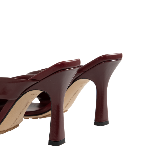 Image 3 of 4 - RED - BOTTEGA VENETA Riva Mule featuring shiny calfskin with padded tubular straps, twisted design and rubber injected leather outsole. Calfskin. Lining: lambskin. Heel: 3.5. Made in Italy.