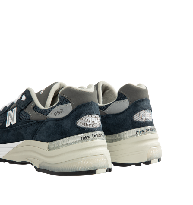 Image 3 of 5 - NAVY - New Balance Unisex Made in USA 992 Core Sneakers feature a mesh upper with premium suede overlays. ABZORB cushioning at the heel and forefoot absorbs impact, while a combined ENCAP and C-CAP midsole provides support. Reflective details and an Ndurance rubber outsole complete the design. Upper: Mesh and Suede. Sole: Rubber. Made in USA with 70% or more domestic value. *Unisex style in men's sizing.
