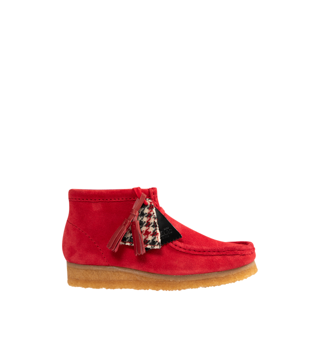 Image 1 of 4 - RED - CLARKS Wallabee Boot featuring a rich red suede upper with hand-stitched apron seams, classic moccasin construction, two exclusive FOBs, amber pebble crepe sole, woven sock label and red tassels.