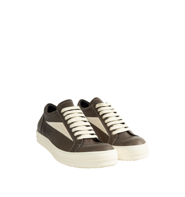 Image 2 of 5 - BLACK - Rick Owens Vintage Sneaks are designed with a low-top design including a lace-up closure, signature shark-tooth soles, and contrast stitching. Upper: 100% Cotton. Lateral Details: 100% Calf Leather. Lining: 100% Cotton. Sole: 100% Thermoplastic Rubber. Sole Height: 3.5 cm / 1.4 in. Closure: Lace-Up. Made in Italy.