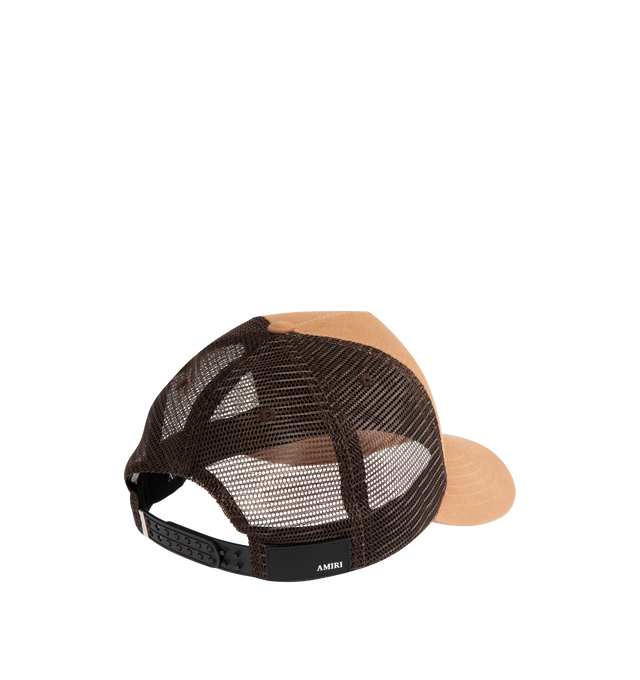 Image 3 of 3 - BROWN - AMIRI MA Outline Trucker Cap featuring cotton canvas and mesh, embroidered eyelets at crown, logo embroidered at face, curved brim, logo patch at back face, snapback fastening and twill lining. 100% cotton. 100% polyester. Made in United States.