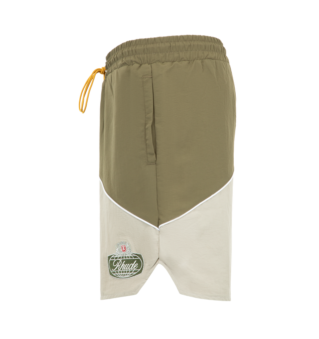 Image 3 of 3 - GREEN - Rhude Desert Racing Track Short is crafted from lightweight nylon and features a relaxed athletic silhouette designed for comfort and movement. Detailed with Desert Racing-inspired graphics, an elasticated waistband, and functional pocket styling, the shorts offer a sport-driven look for everyday wear. Main Material: 100% Nylon. Made in the USA.