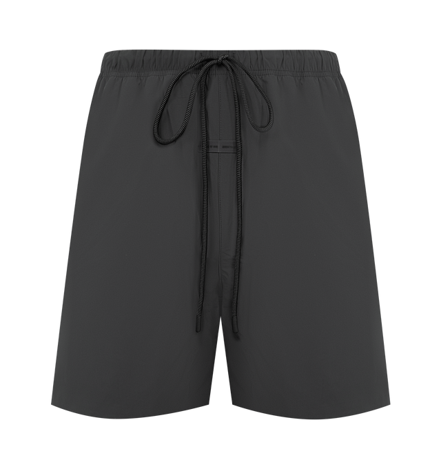 Image 1 of 3 - BLACK - FEAR OF GOD ESSENTIALS Tech Nylon Classic Short featuring a tech nylon-spandex blend, the leg is finished with a metallic 3M-printed Essentials logo, encased elastic waistband with elongated drawcords, side seam pockets and a Fear of God Essentials rubberized label stitched at the center front. 16% spandex, 84% nylon.