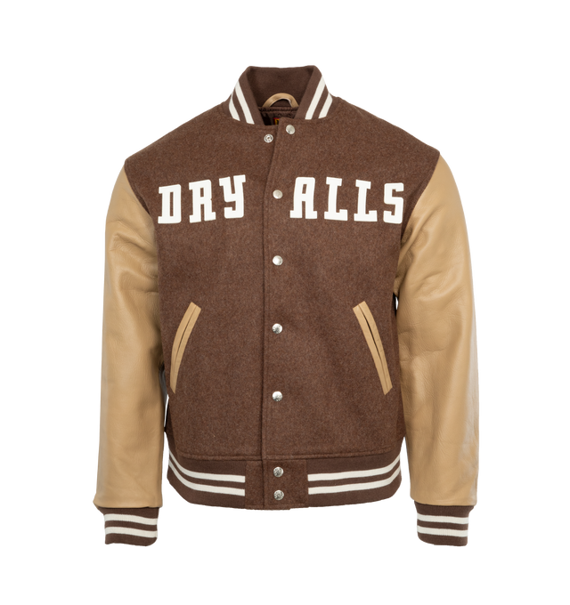 Image 1 of 4 - BROWN - HUMAN MADE Varsity Jacket featuring rib knitted collar, front snap tab closure, two side waist pockets, soft viscose lining, rib knitted cuffs and hemline. 90% wool, 10% nylon. Sleeve: cow leather. Lining: 100% polyester. 