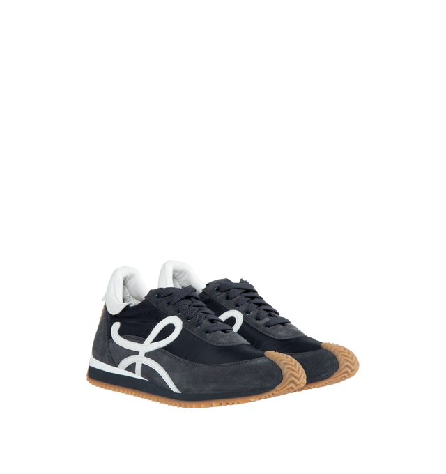 Image 2 of 5 - NAVY - LOEWE Flow Runner featuring gold LOEWE logo, lace up sneaker, rubber wavy sole, embossed Anagram on tongue and L monogram on the side. Nylon/suede. Made in Italy. 