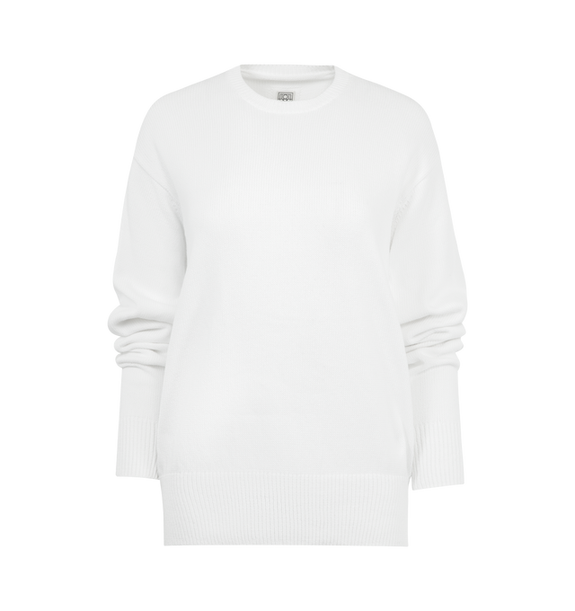 Image 1 of 2 - WHITE - TOTEME Crew Knit Sweater featuring long sleeves, crewneck, ribbed cuffs and hem and regular fit. 100% organic cotton.