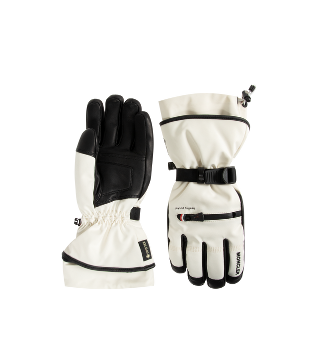 Image 1 of 3 - WHITE - MONCLER GRENOBLE Padded Gloves featuring four-way stretch 2L technical polyester, nylon lining, padded, zipper closure, inner pocket, adjustable cuffs and logo detail. 87% polyester, 13% elastane/spandex. 100% polyamide/nylon.